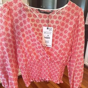 Fun stylish pink top!  Zara brand with tags never worn.  Super cute